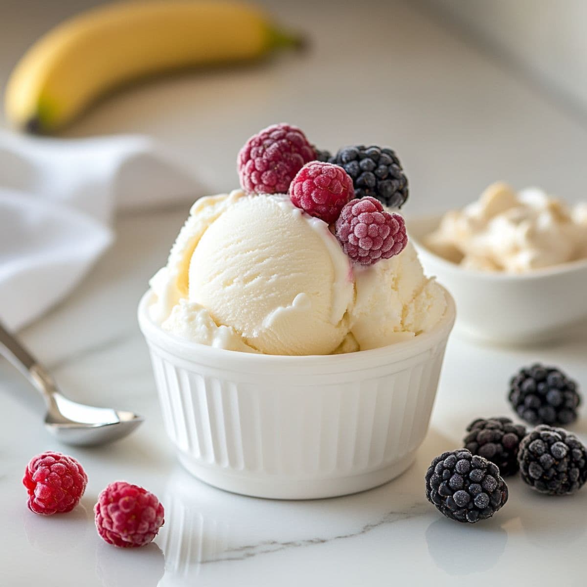 Creamy homemade frozen treat made with Ninja Creami, served in a bowl with fresh fruit on top