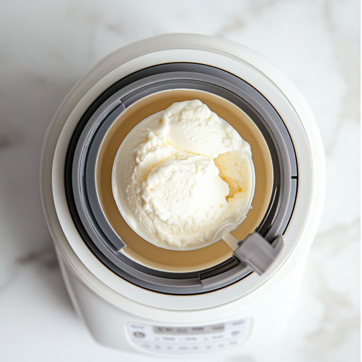 Ninja Creami machine spinning a frozen base on the ice cream setting