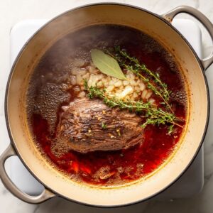 build the flavor base for pot roast recipe with onions, garlic, wine, and tomato paste