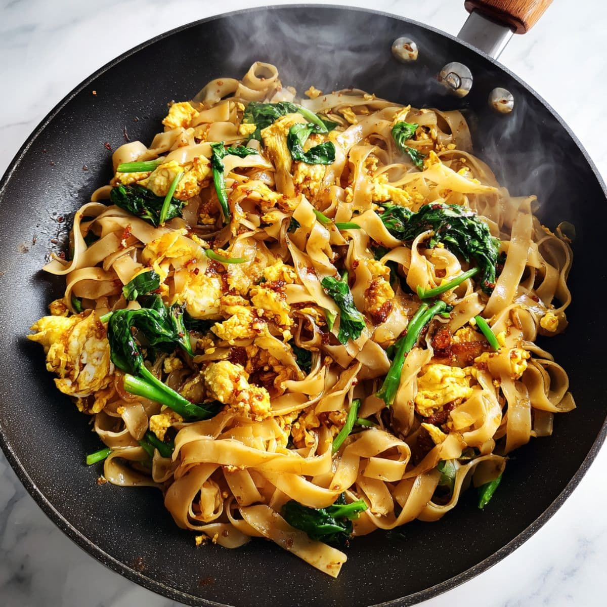 finish strong for phat si-io recipe with scrambled eggs folded into glossy noodles