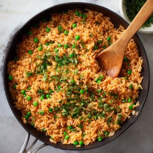 fluff and finish spanish rice recipe with peas and cilantro for light, fluffy texture