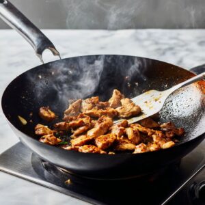 get the wok smoking hot for phat si-io recipe with garlic and protein sizzling in oil