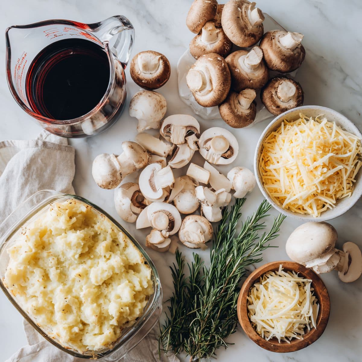 optional but worth it ingredients for cottage pie recipe like mushrooms, red wine, rosemary, and cheese