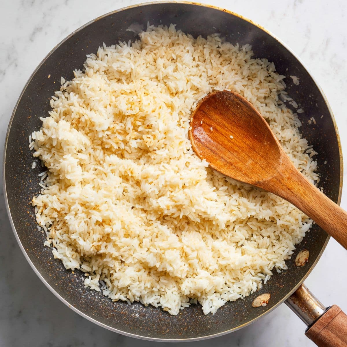 toast the rice for spanish rice recipe until lightly golden and aromatic