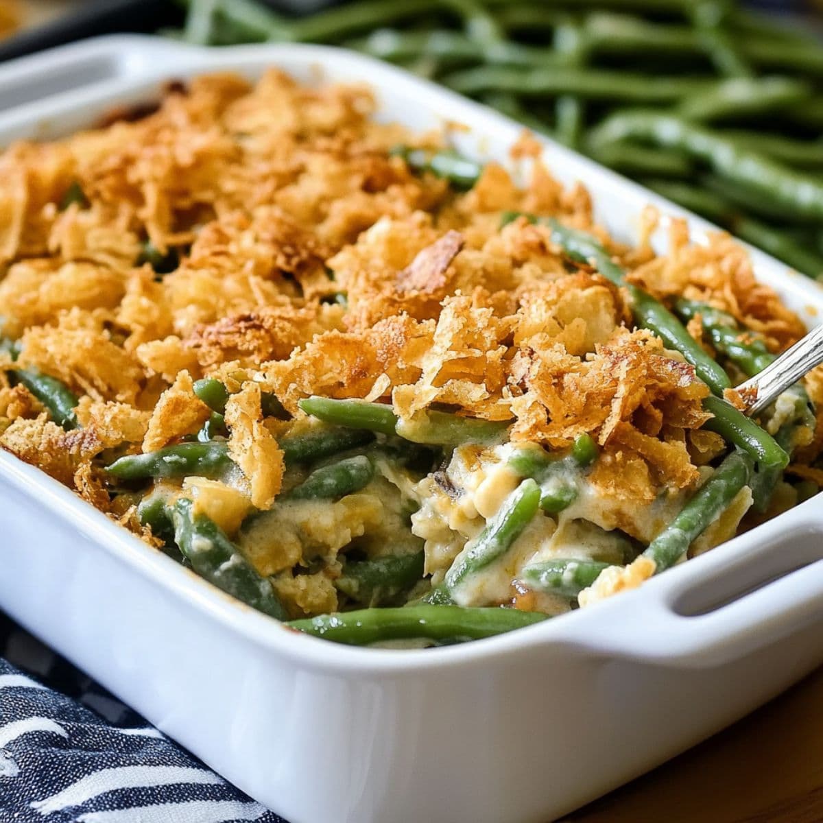 top and crisp green bean casserole recipe with golden fried onions just out of the oven