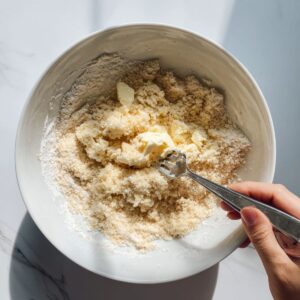 make the topping for apple cobbler recipe with cold butter mashed into flour and milk added