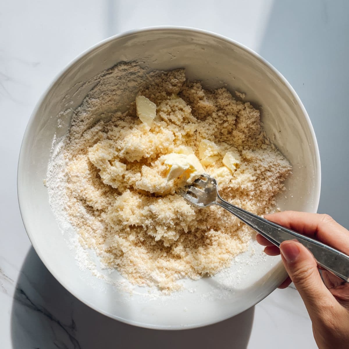make the topping for apple cobbler recipe with cold butter mashed into flour and milk added