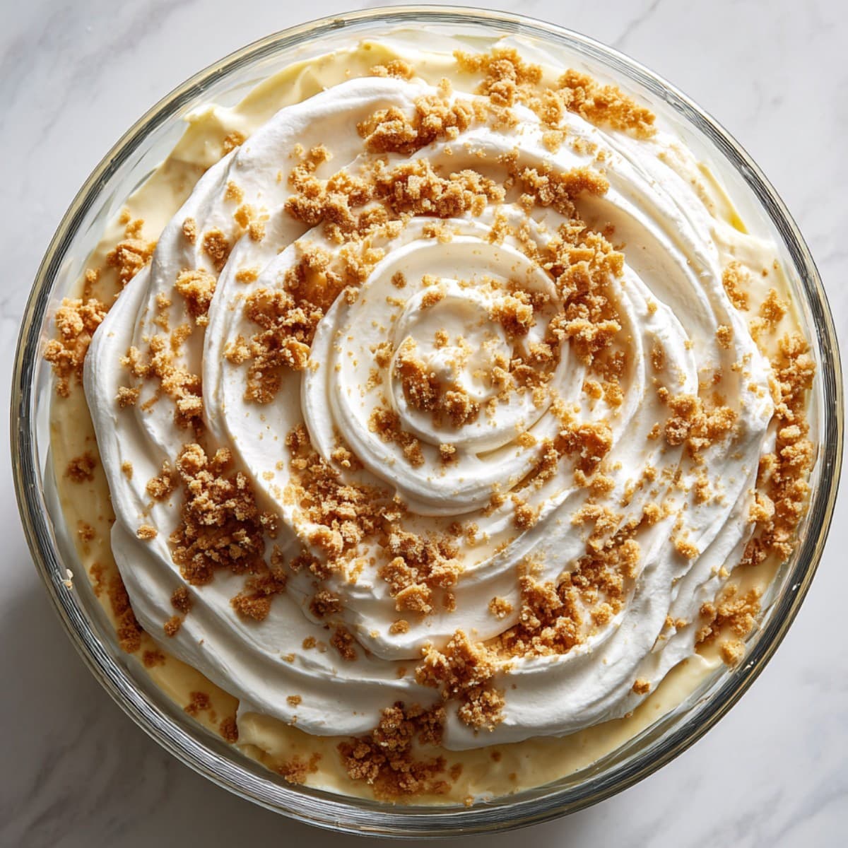 banana pudding recipe chilled and topped with whipped cream and crushed wafers