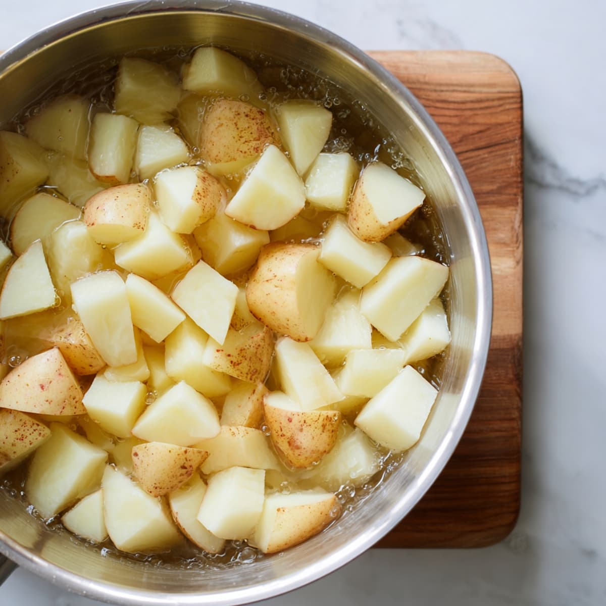 cooking potatoes for mashed potatoes recipe in boiling salted water