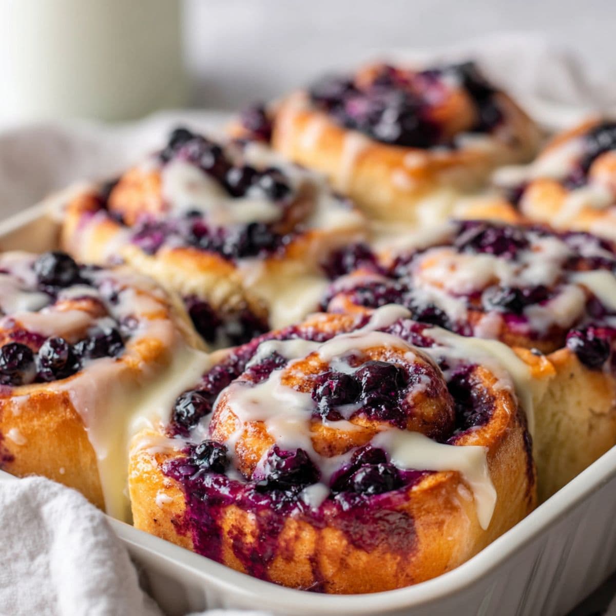 glazing blueberry cinnamon rolls