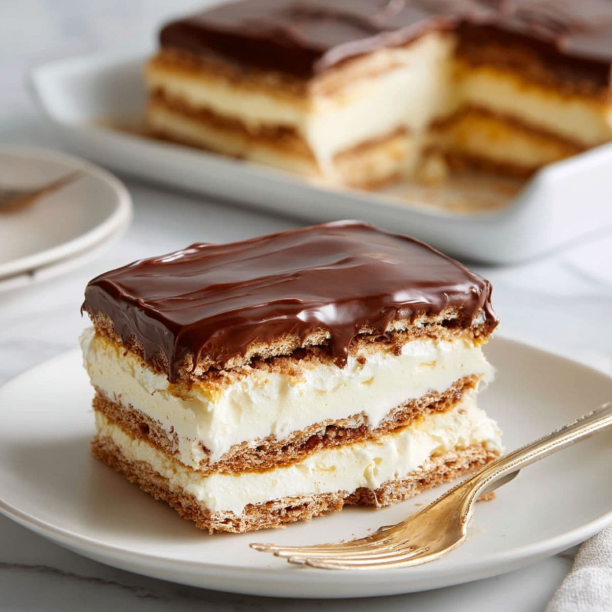 slicing chilled eclair cake