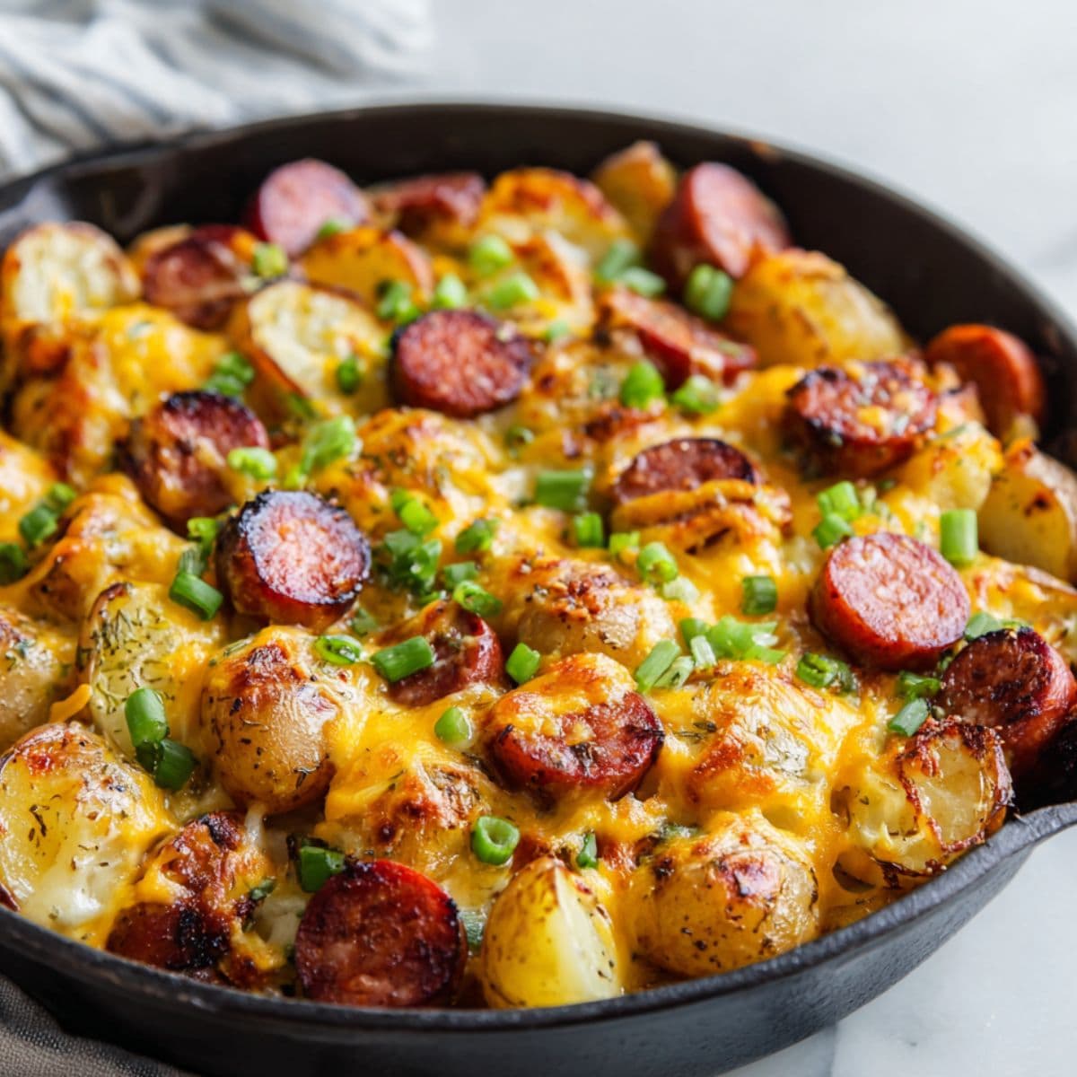 topping cheesy ranch potatoes and smoked sausage