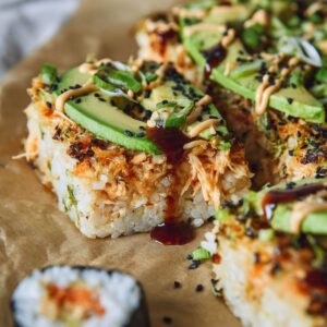 serving spicy salmon sushi bake with nori