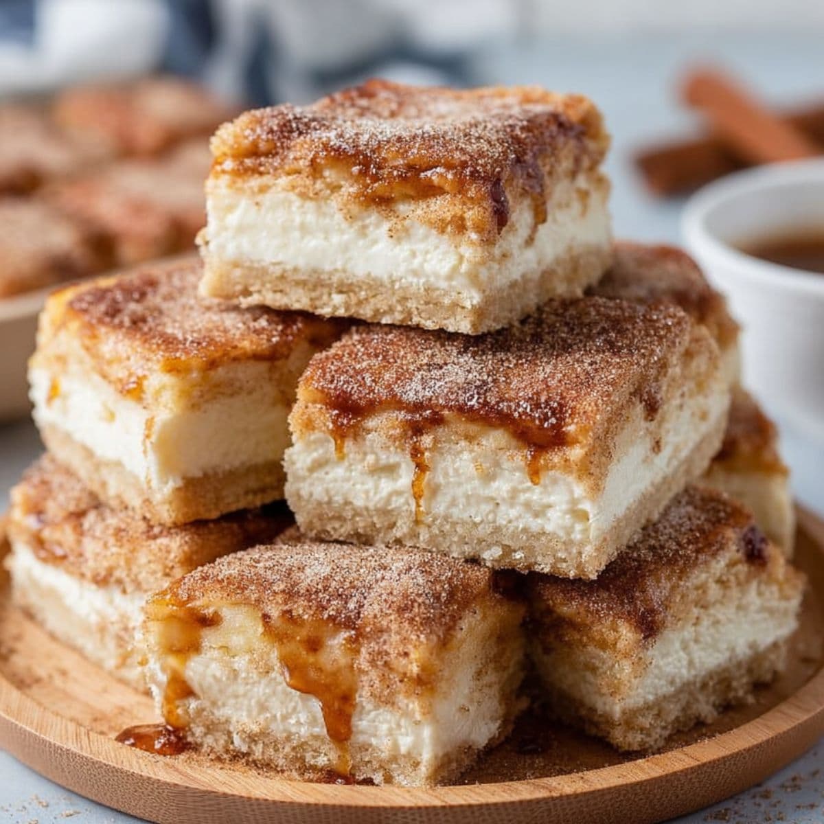 slicing churro cheesecake bars